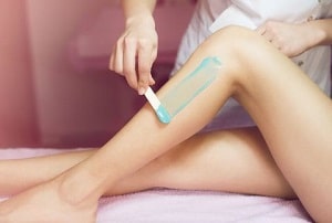 Women Having Her Legs Waxed